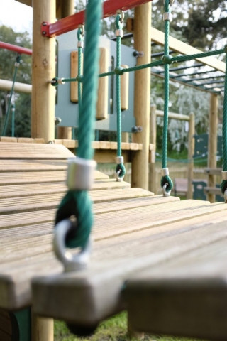 A close-up of the wooden bridge on the activity tower